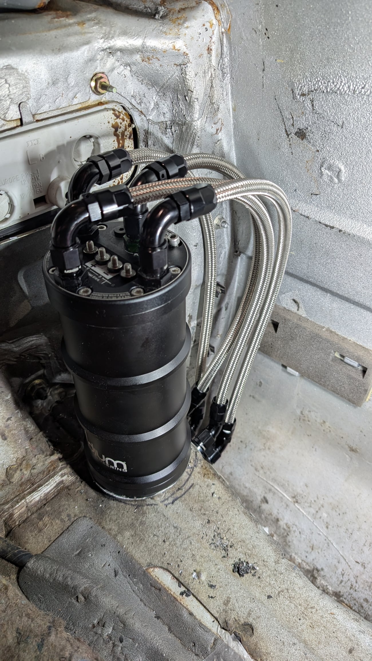 Fuel surge plumbing